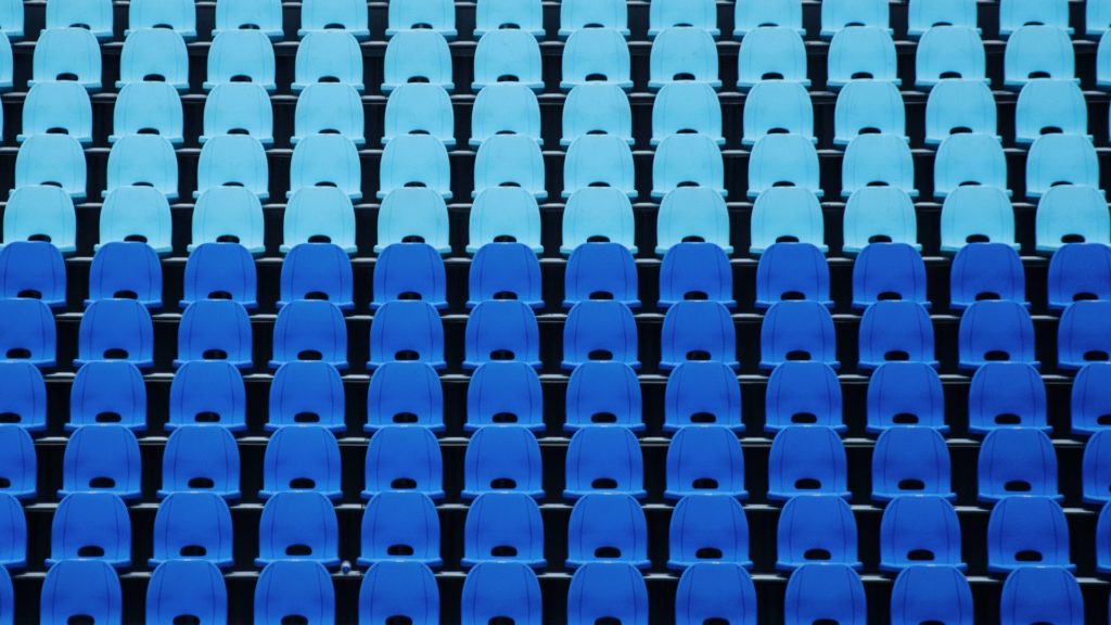Empty stadium seats symbolizing keeping audience segments broad when marketing.